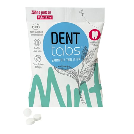 Denttabs toothpase tablets in a paper sachet.