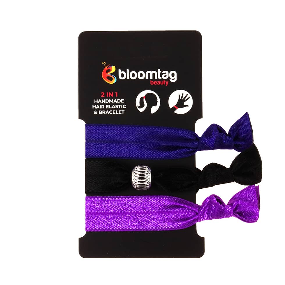 A set of twistband hair bands in black, purple and navy blue.