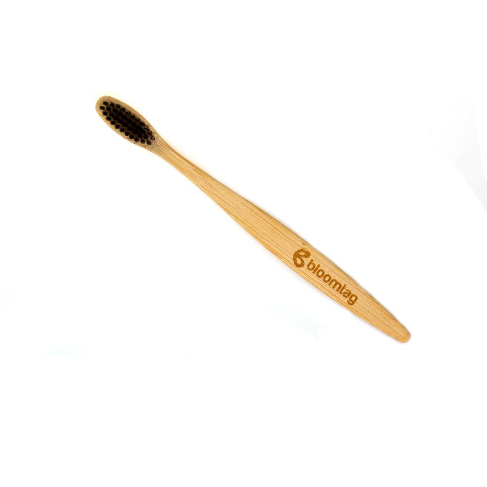Biodegradable bamboo toothbrush with active carbon bristles